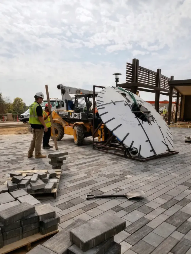 Keystone crew and loader working on a paver plaza