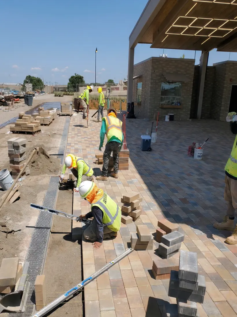 Keystone crew laying pavers on a commercial plaza