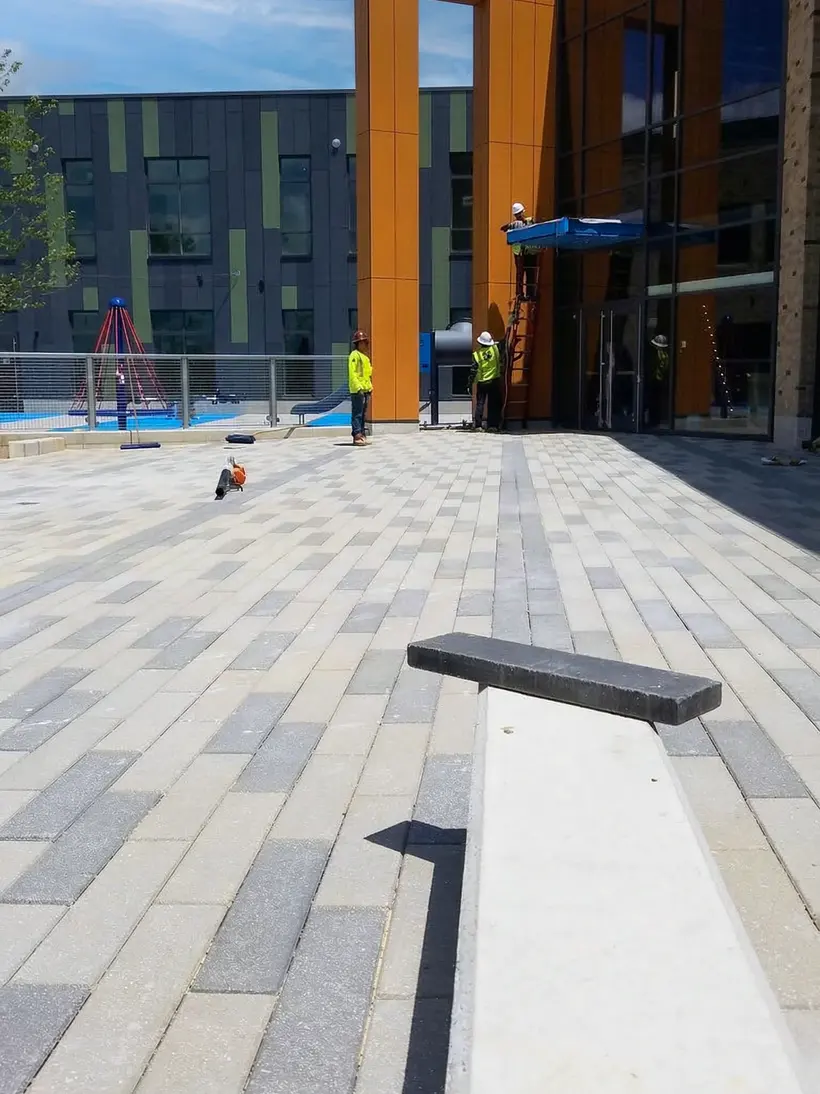 Clean plaza with light granite paver bands