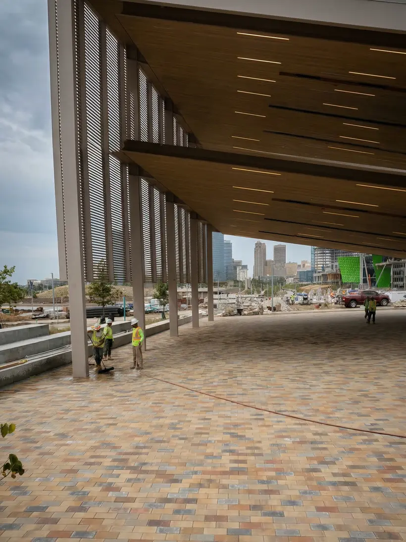 Pergola terrace with multicolor pavers and the city skyline