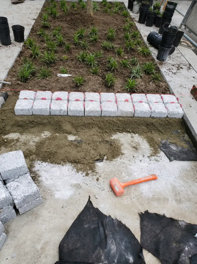Planting beds with granite prepped for planting