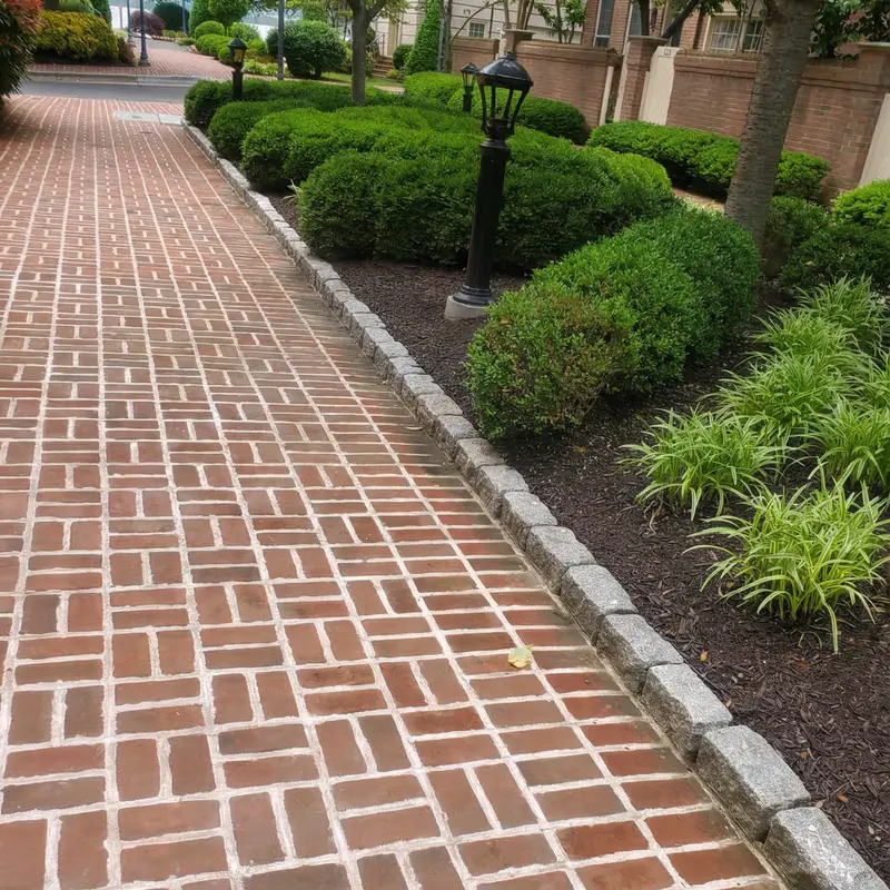 Herringbone brick paving laid by hand
